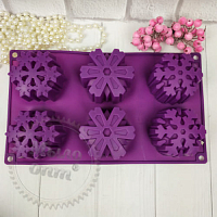 Silicone mold on the tablet Curly snowflakes