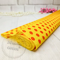 Yellow crepe paper with red peas